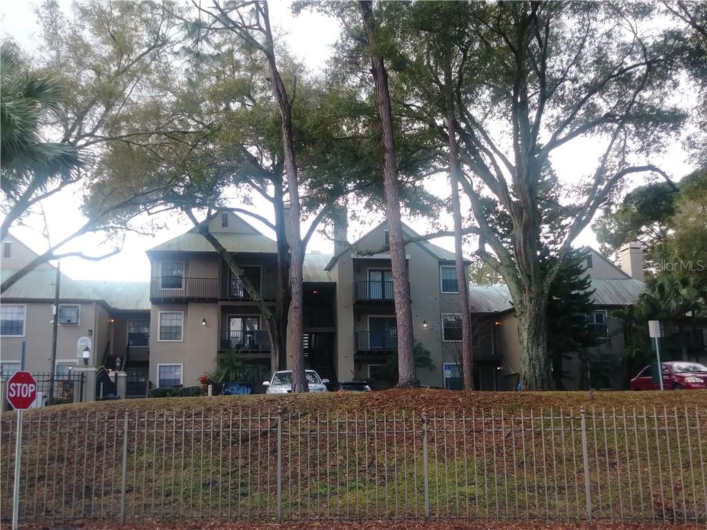 200 Afton Square, Unit 305 Altamonte Springs, FL 32714 - Photo 20 of 22 a view of a building with trees