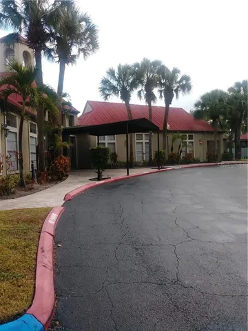 a view of a building with a yard