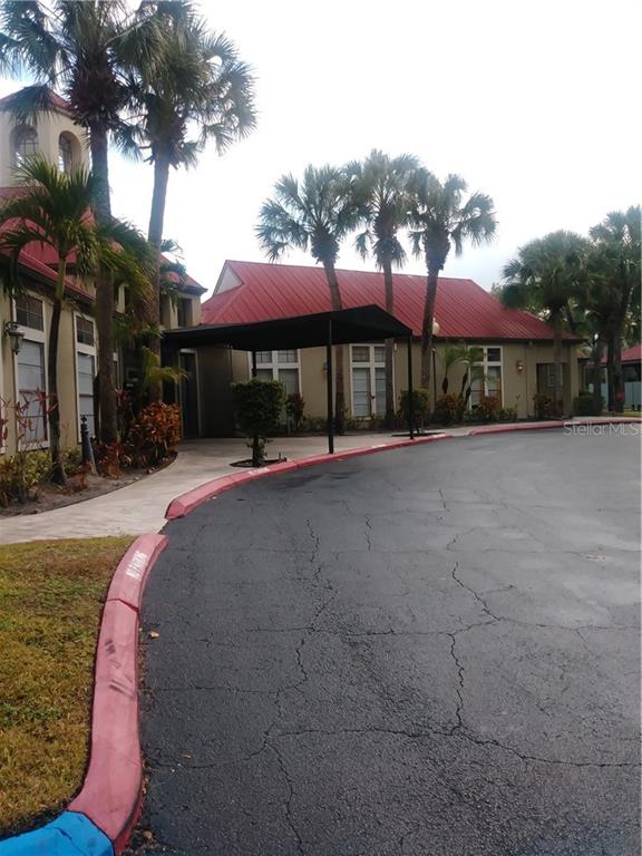 200 Afton Square, Unit 305 Altamonte Springs, FL 32714 - Photo 21 of 22 a view of a building with a yard