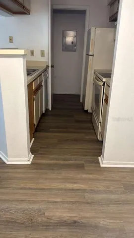 a view of a kitchen from the hallway