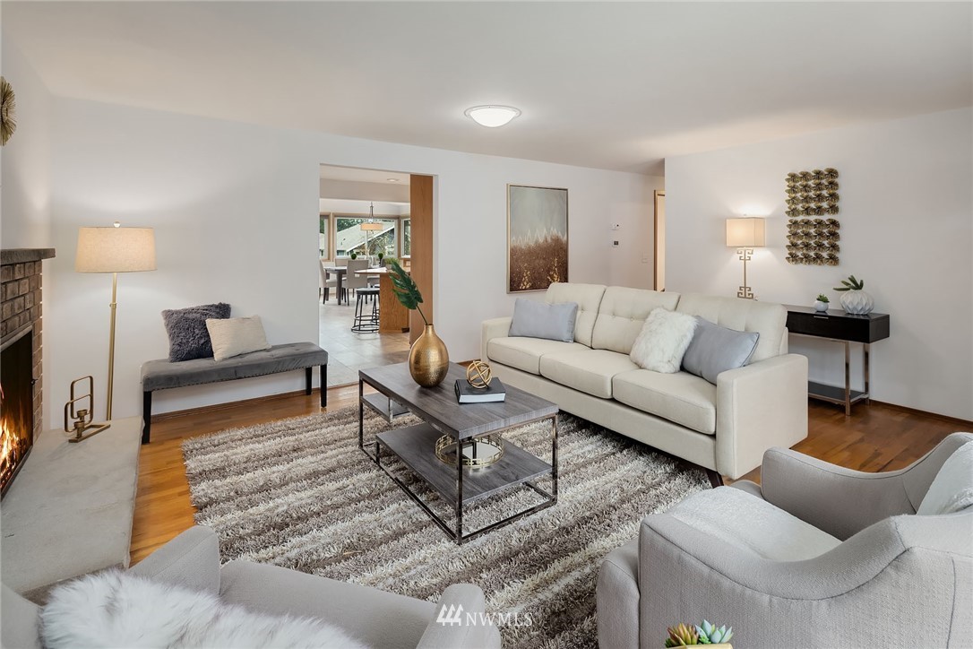 6611 Southeast 5th Place Renton, WA 98059 - Photo 2 of 25 a living room with furniture a lamp and a rug