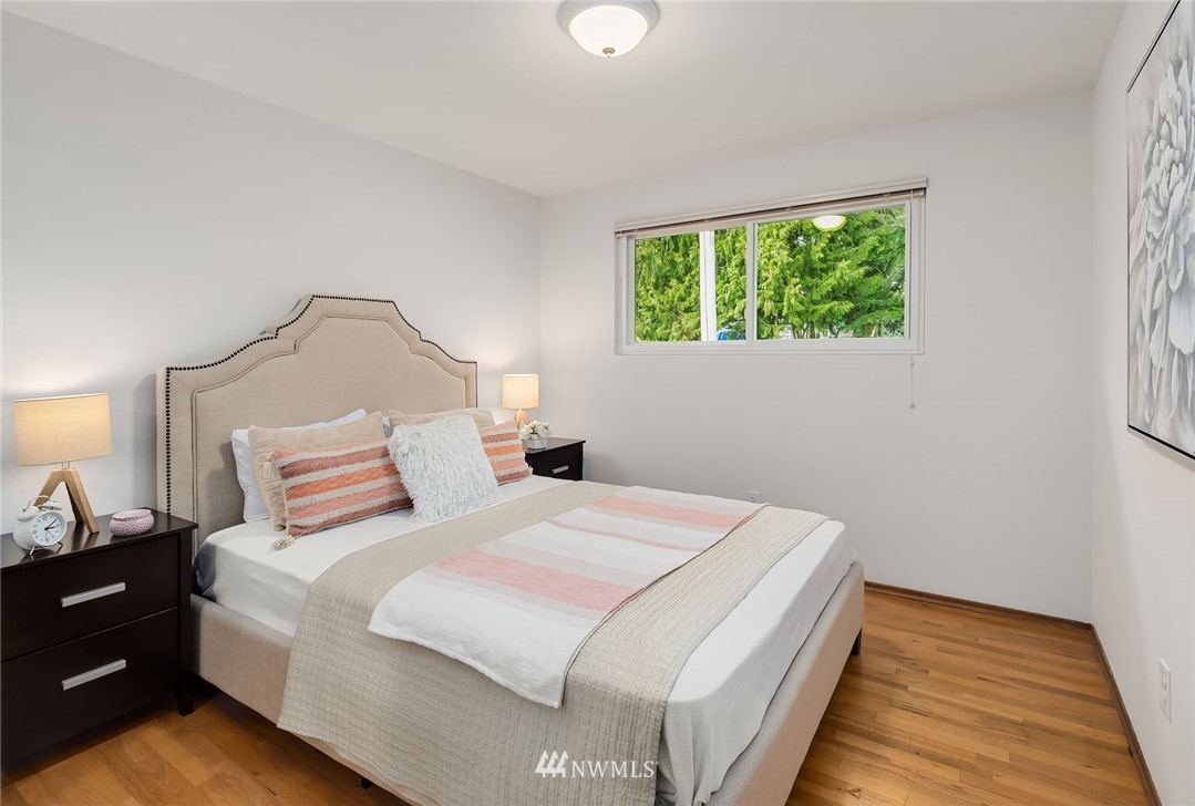 6611 Southeast 5th Place Renton, WA 98059 - Photo 12 of 25 a bedroom with a bed and a window
