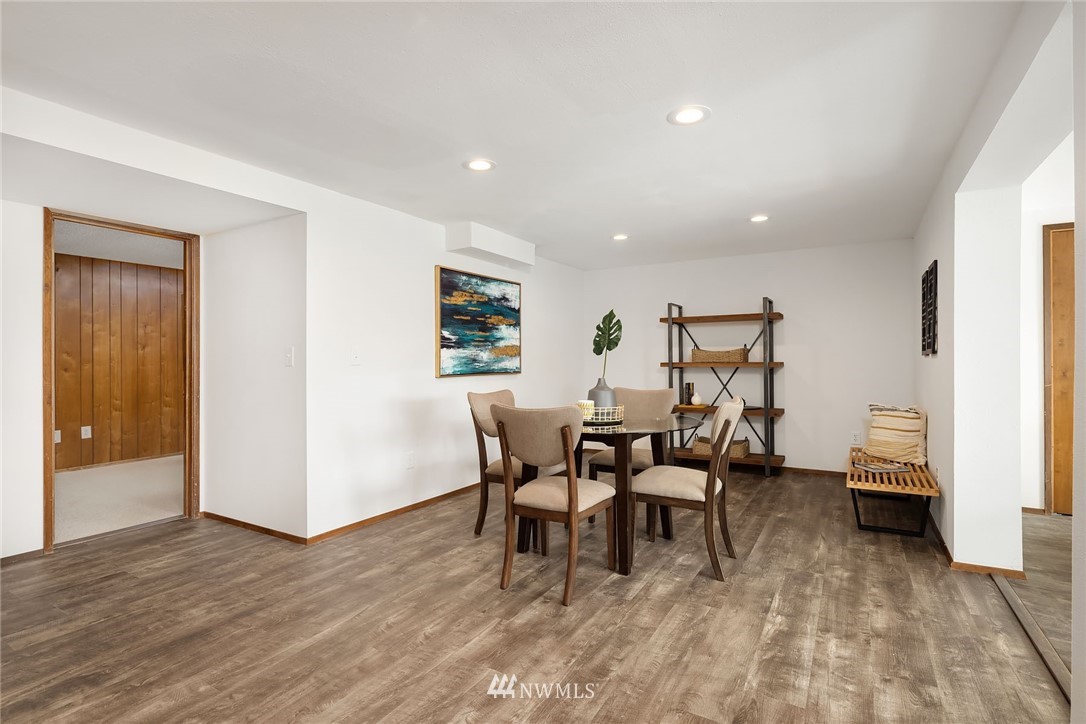 6611 Southeast 5th Place Renton, WA 98059 - Photo 14 of 25 a dining room with furniture and wooden floor
