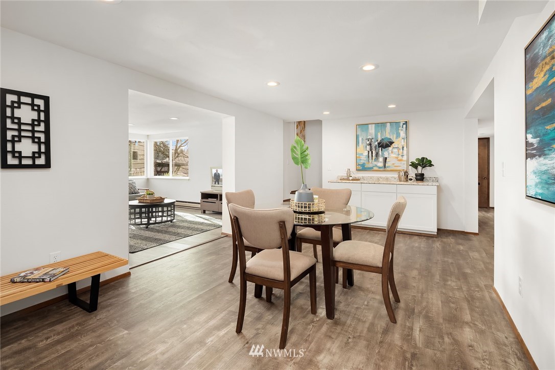 6611 Southeast 5th Place Renton, WA 98059 - Photo 15 of 25 a view of a dining room with furniture and wooden floor