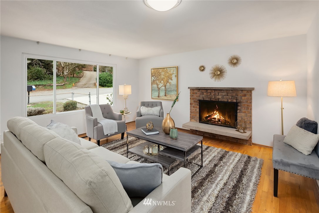 6611 Southeast 5th Place Renton, WA 98059 - Photo 3 of 25 a living room with furniture and a fireplace