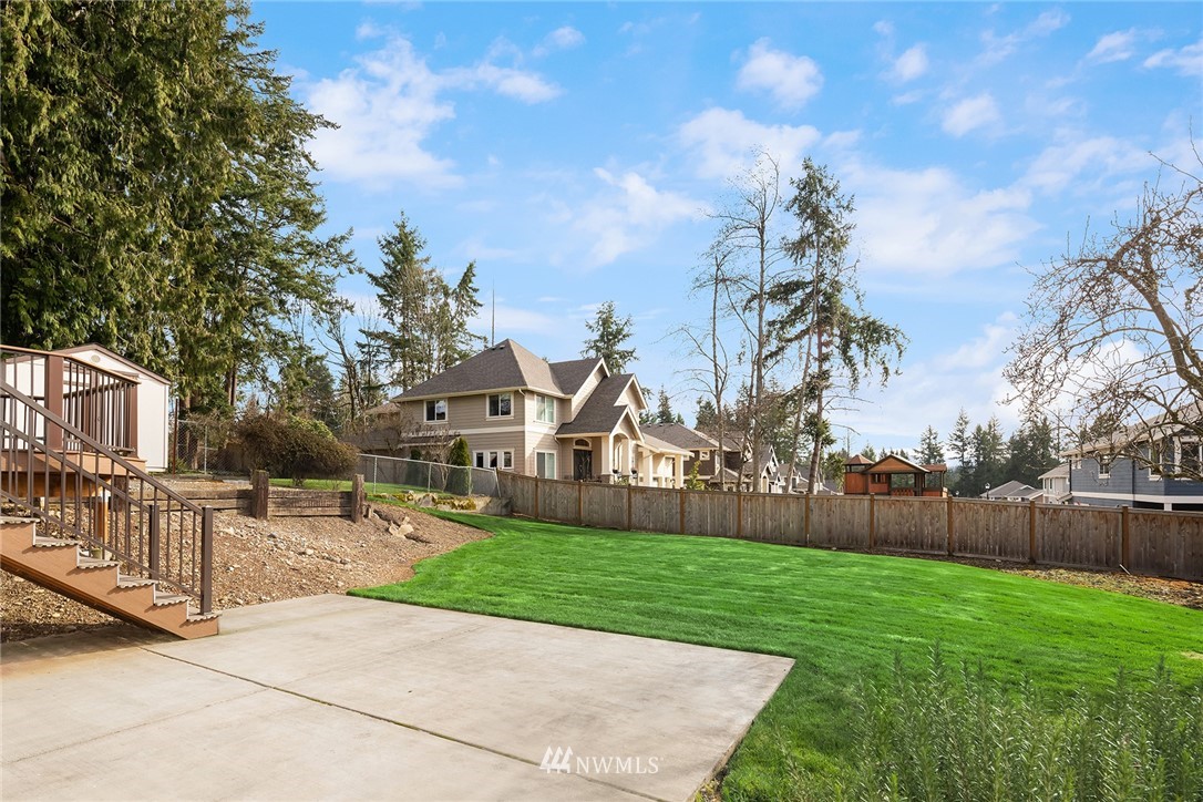 6611 Southeast 5th Place Renton, WA 98059 - Photo 24 of 25 a view of a house with a big yard plants and large trees