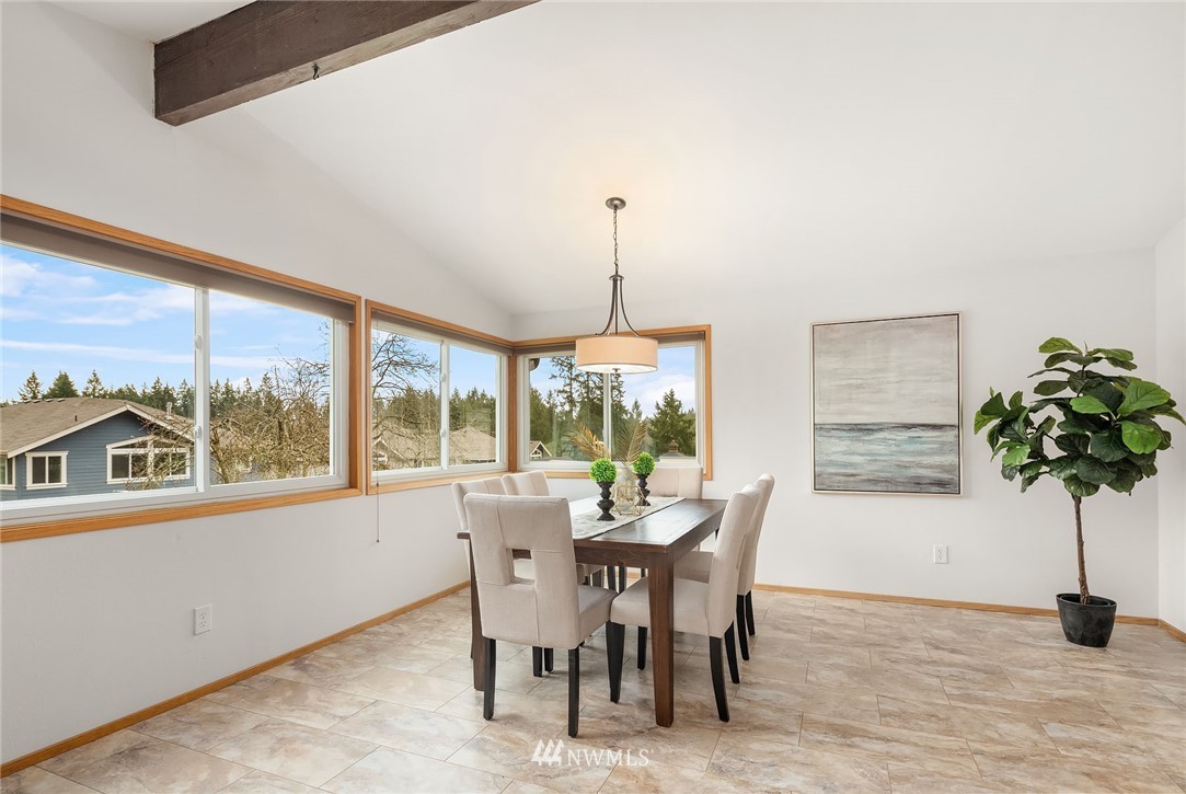 6611 Southeast 5th Place Renton, WA 98059 - Photo 8 of 25 a view of a dining room with furniture window and outside view