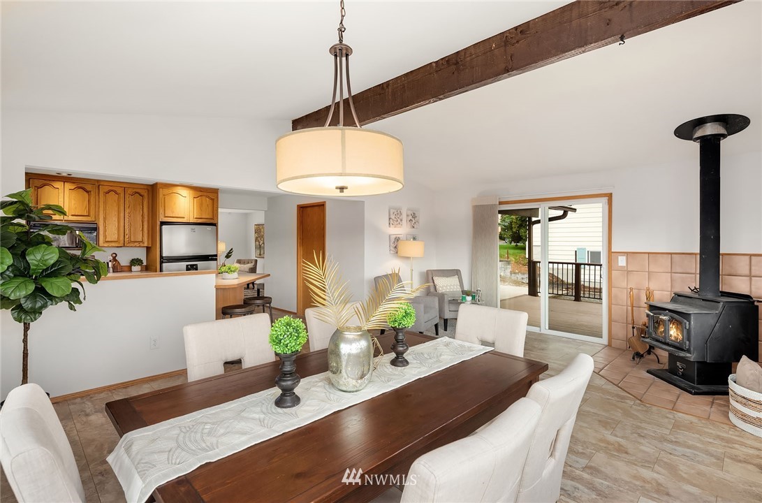 6611 Southeast 5th Place Renton, WA 98059 - Photo 9 of 25 a living room with furniture a chandelier and a wooden floor