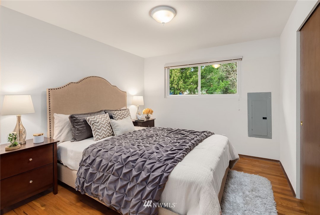 6611 Southeast 5th Place Renton, WA 98059 - Photo 10 of 25 a bedroom with a bed and a window