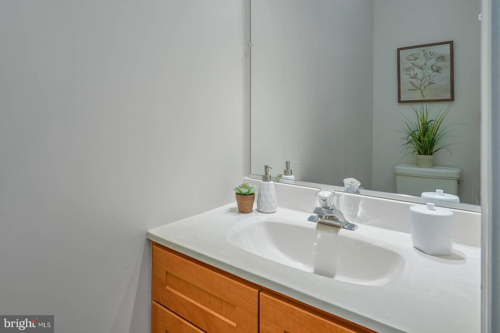 9303 Kendal Circle Laurel, MD 20723 - Photo 13 of 50 a bathroom with a sink and a mirror