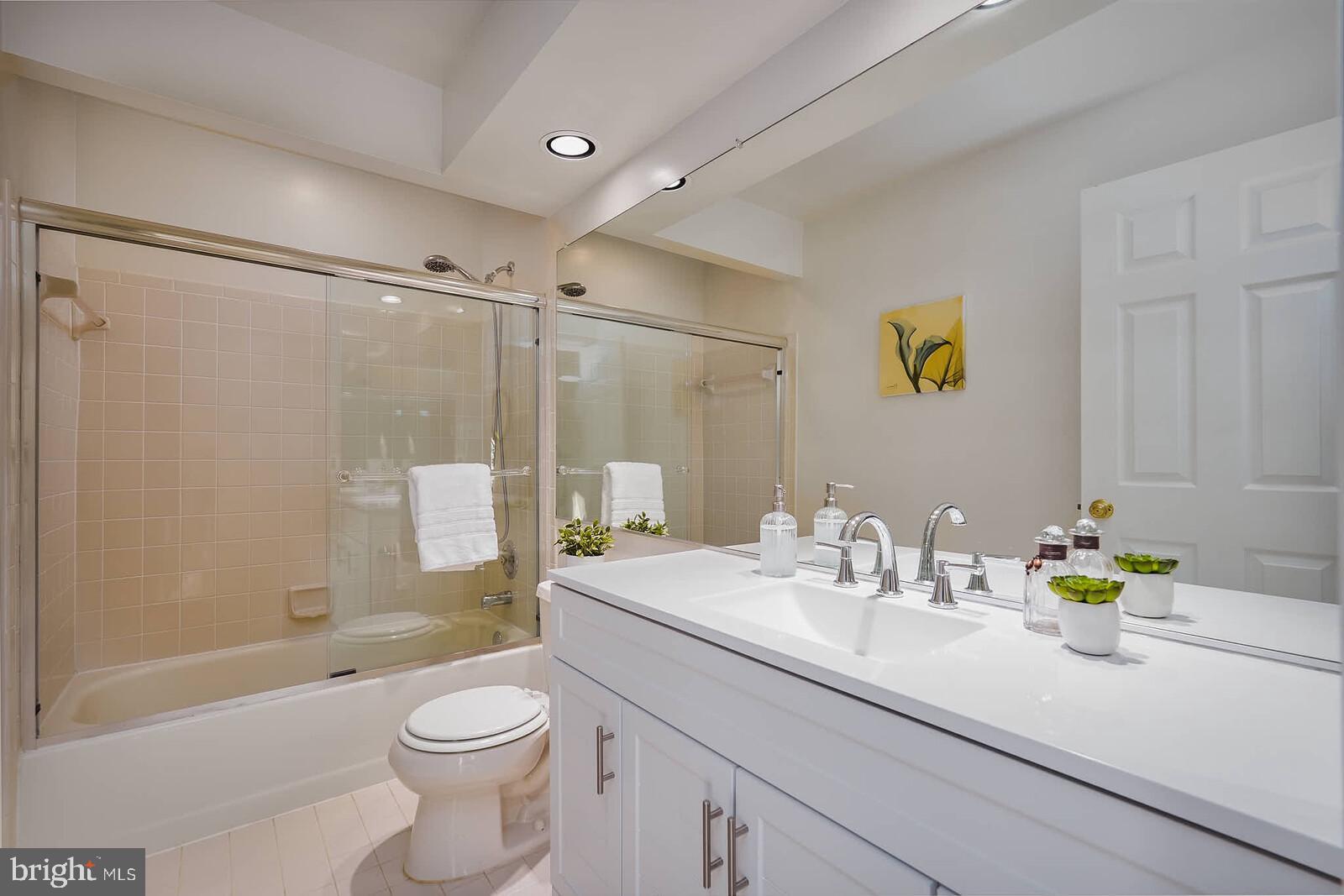 9303 Kendal Circle Laurel, MD 20723 - Photo 23 of 50 a bathroom with a sink a toilet and shower