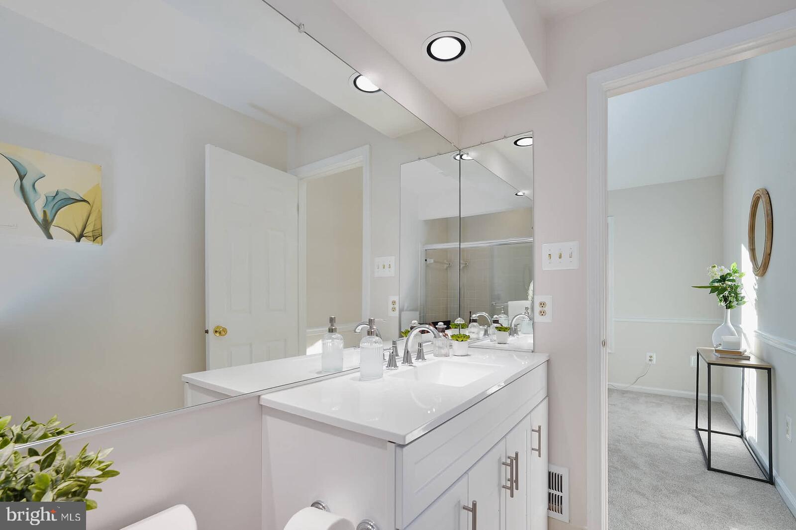 9303 Kendal Circle Laurel, MD 20723 - Photo 24 of 50 a bathroom with a sink and a mirror