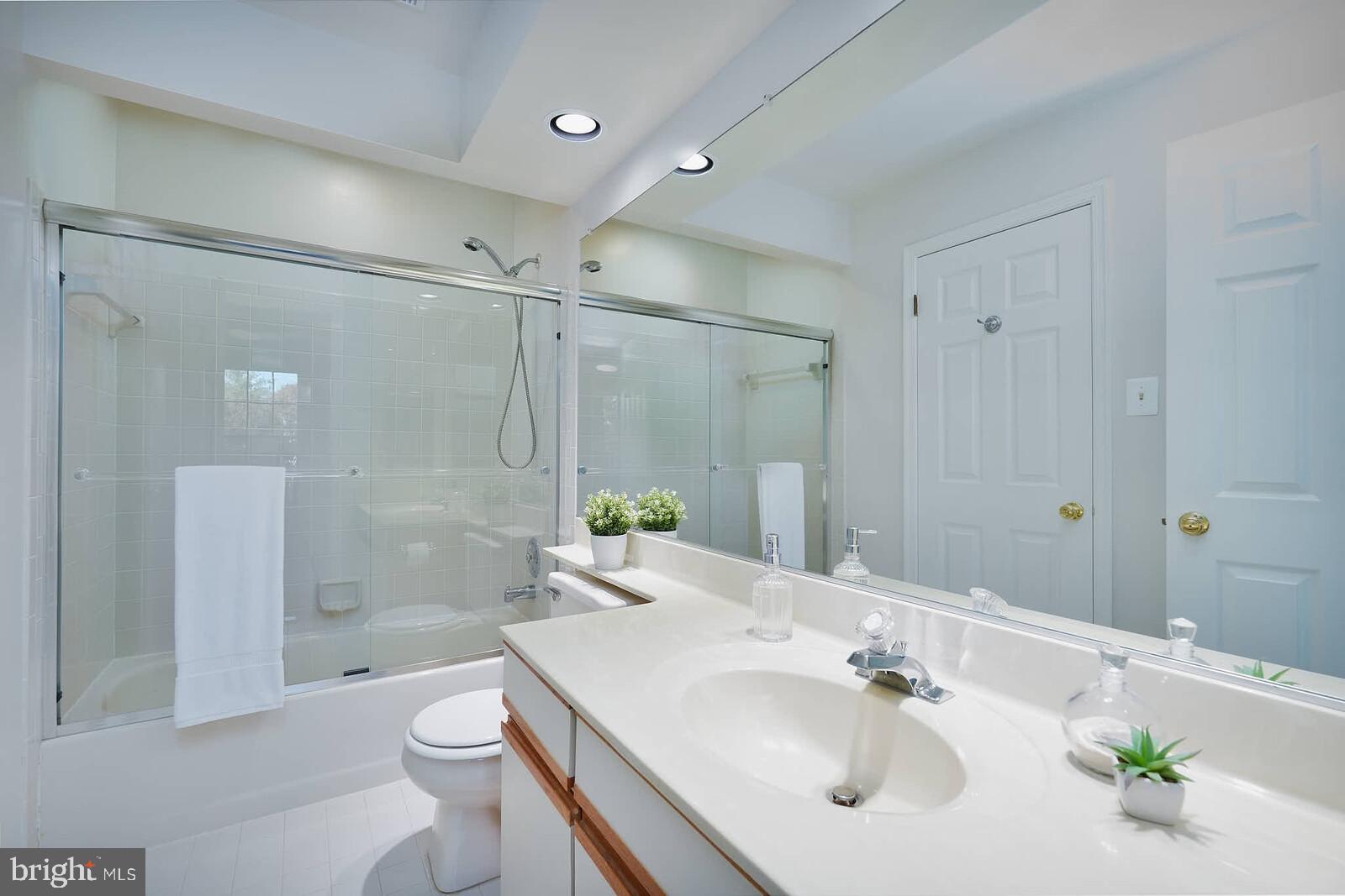 9303 Kendal Circle Laurel, MD 20723 - Photo 31 of 50 a bathroom with a sink toilet and shower