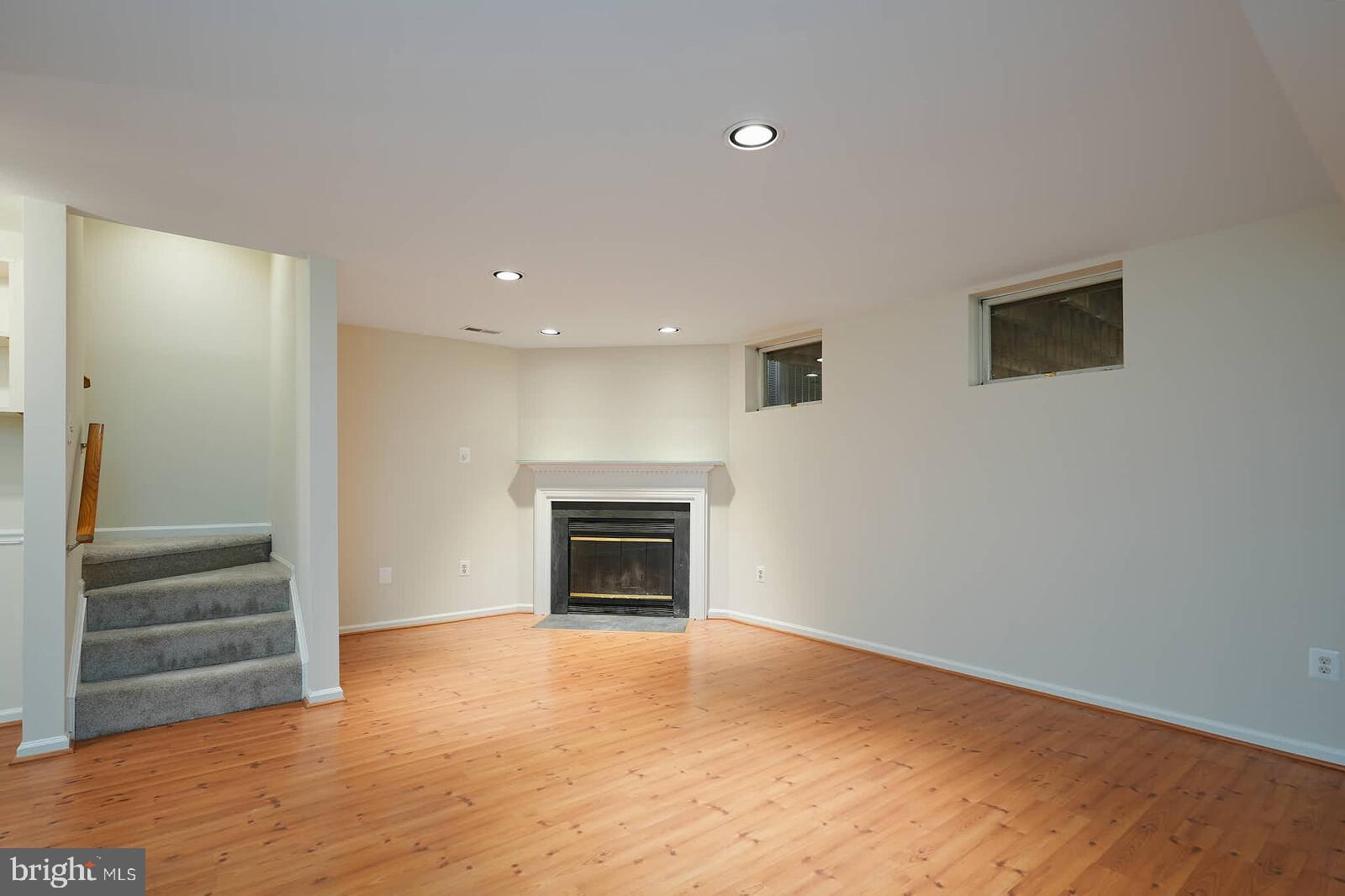 9303 Kendal Circle Laurel, MD 20723 - Photo 32 of 50 a view of empty room with wooden floor and fireplace