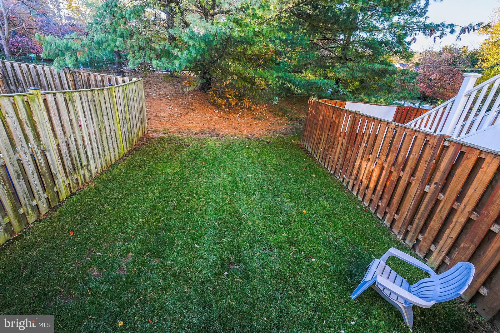 9303 Kendal Circle Laurel, MD 20723 - Photo 41 of 50 a view of a backyard with a wooden fence