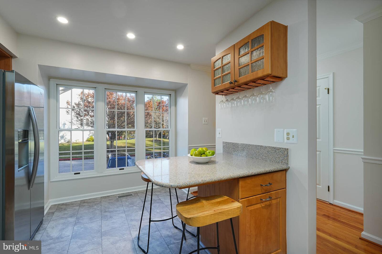 9303 Kendal Circle Laurel, MD 20723 - Photo 5 of 50 a view of kitchen island with furniture and windows