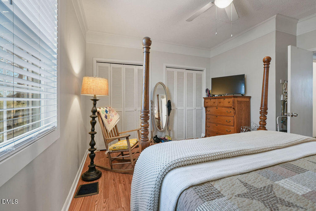 305 South 17th Street Erwin, NC 28339 - Photo 13 of 35 a bedroom with a bed dresser and a window
