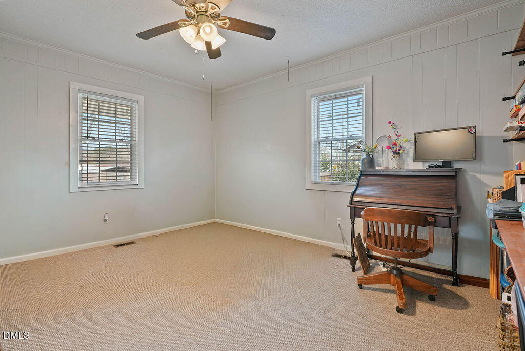 305 South 17th Street Erwin, NC 28339 - Photo 14 of 35 a workspace with chandelier fan and window