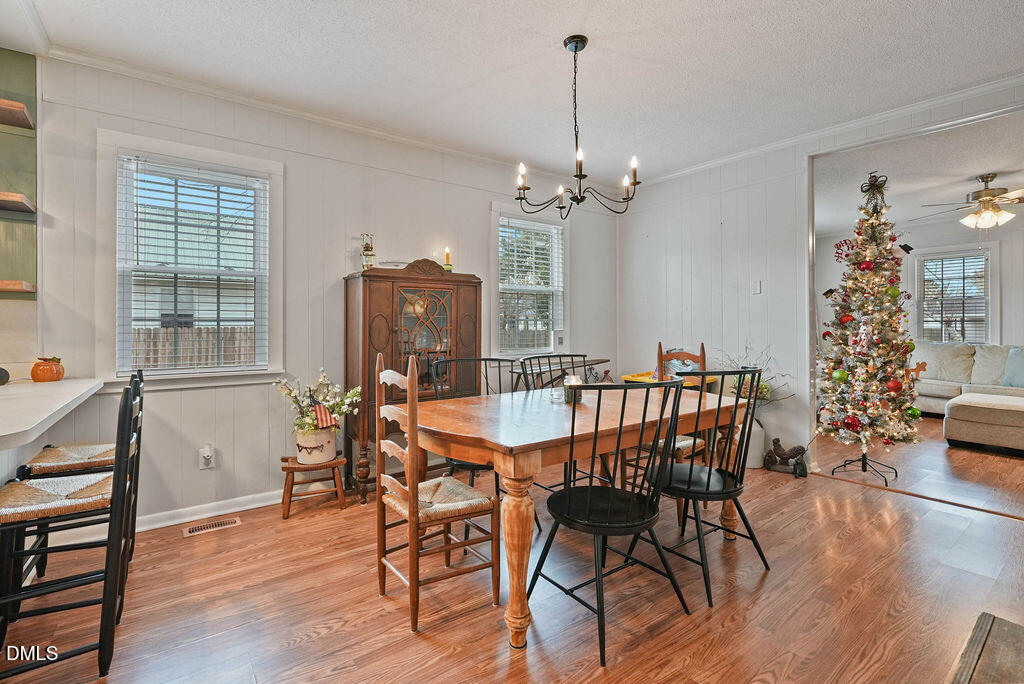 305 South 17th Street Erwin, NC 28339 - Photo 18 of 35 a view of a dining room with furniture window and wooden floor
