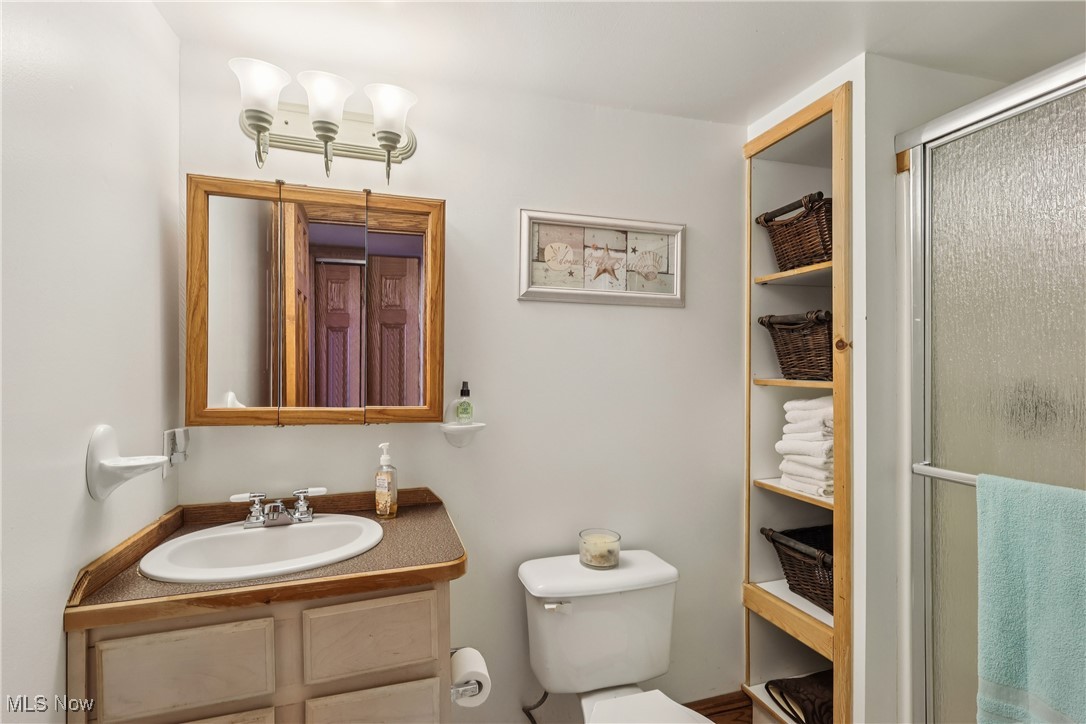 337 Cedar Point Road Sandusky, OH 44870 - Photo 8 of 50 Bathroom with vanity and a shower stall