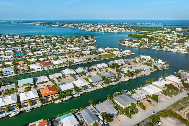 an aerial view of a city with ocean view