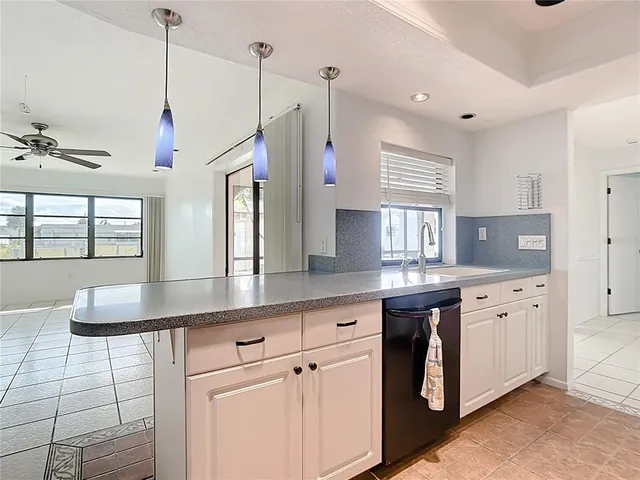 a kitchen with sink and window
