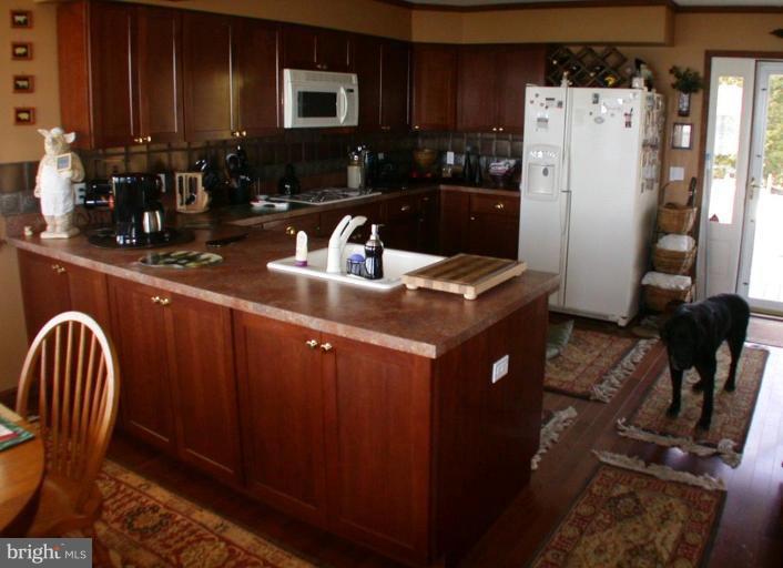 5301 Ross Neck Road Cambridge, MD 21613 - Photo 6 of 30 Breakfast Room into Kitchen