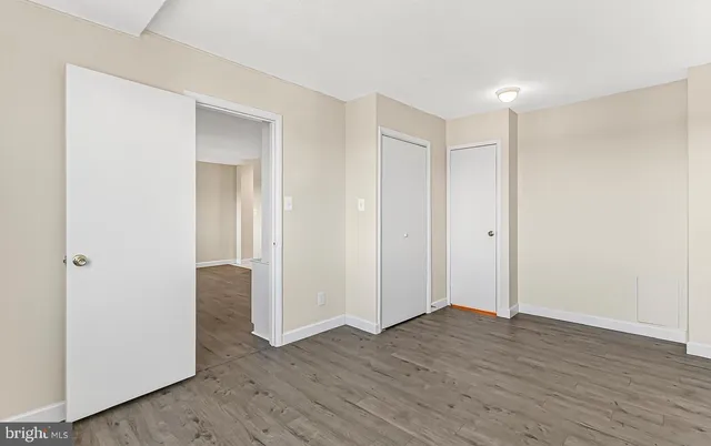 a view of hallway with wooden floor