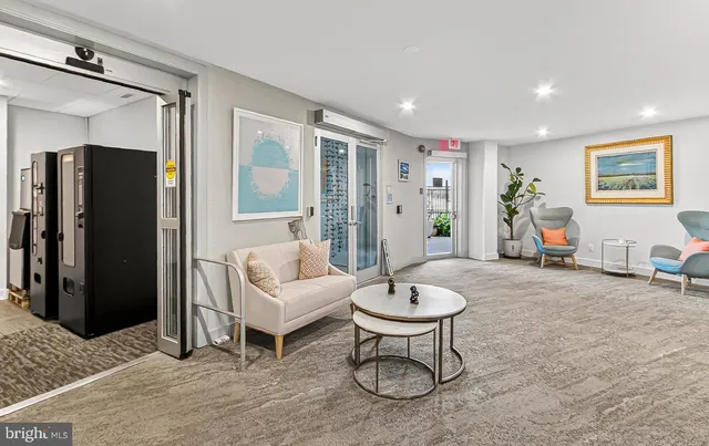 a living room with furniture and a table
