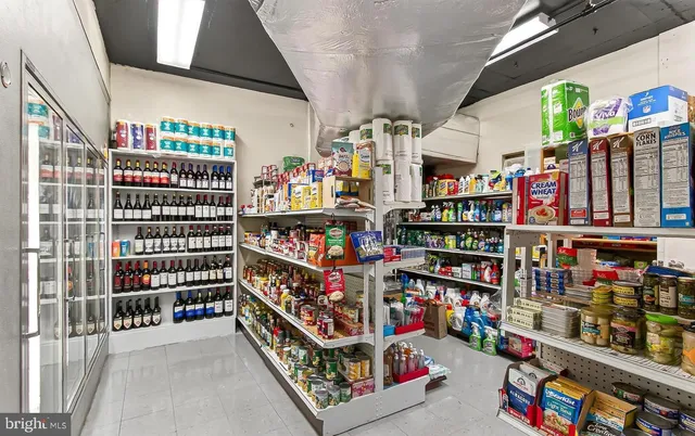 a room with lots of books and a large window