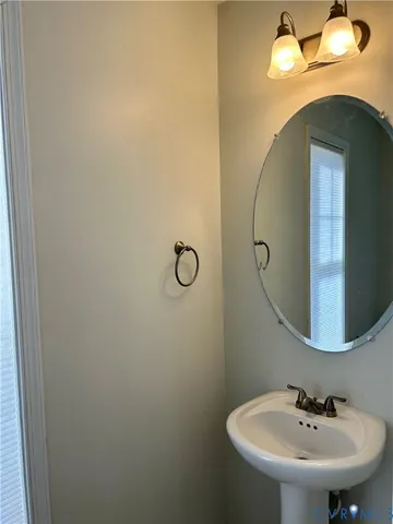a bathroom with a sink and mirror