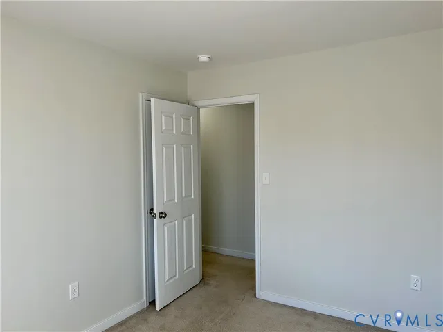 an empty room with a mirror