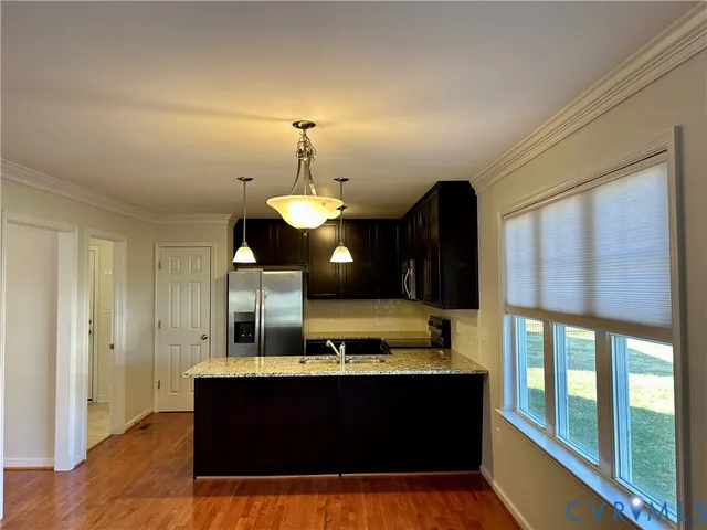 a view of living room with furniture and a window