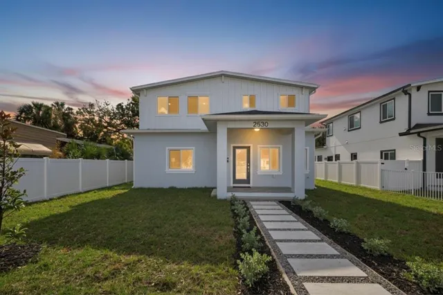 a view of a house with a back yard