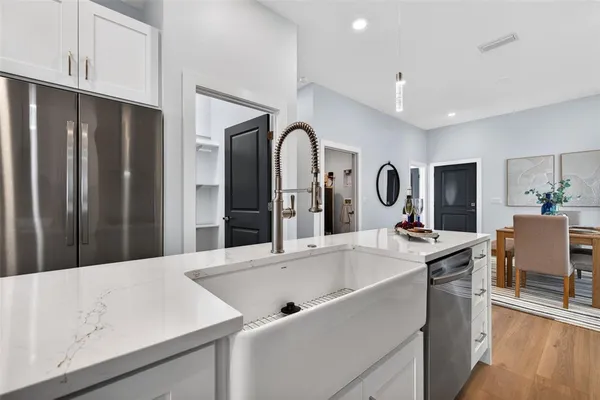 a view of kitchen with sink microwave and stove