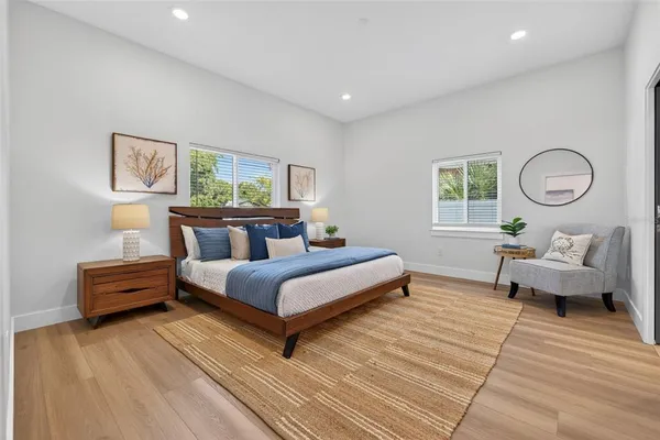 a bedroom with furniture and a window