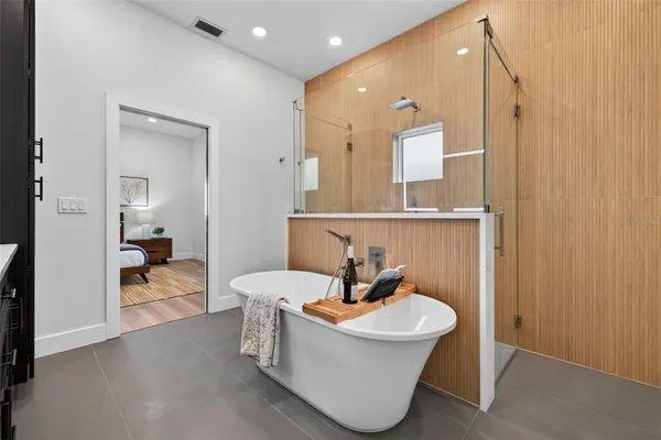 a living room with a sink furniture and a mirror
