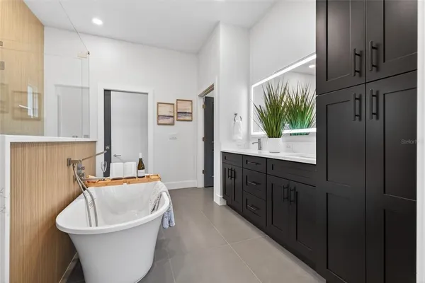 a bathroom with a bathtub and sink