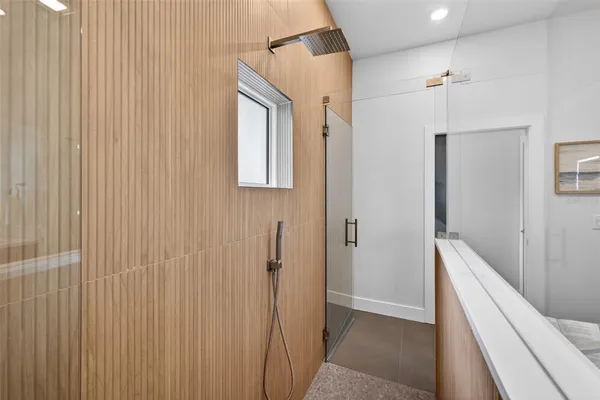 a bathroom with a bathtub and a shower