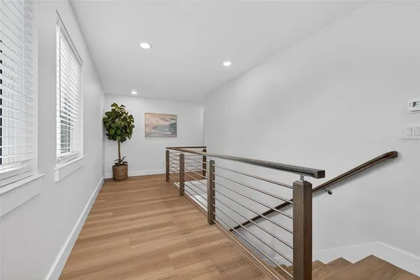 a spacious bedroom with a bed and a window