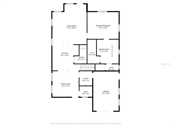 a view of a house with a small yard and plants