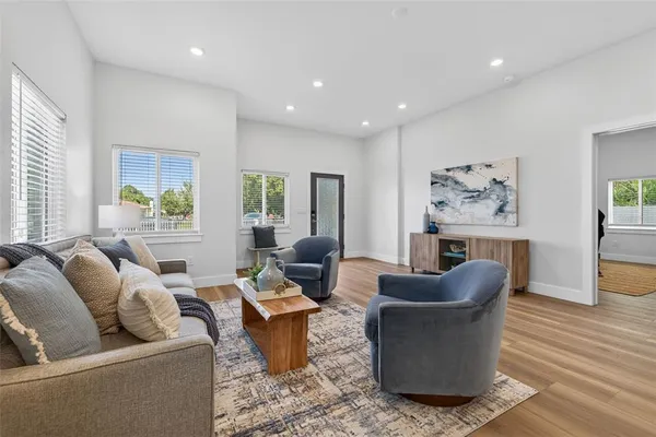 a living room with furniture and a large window