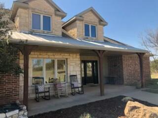 a front view of a house with patio