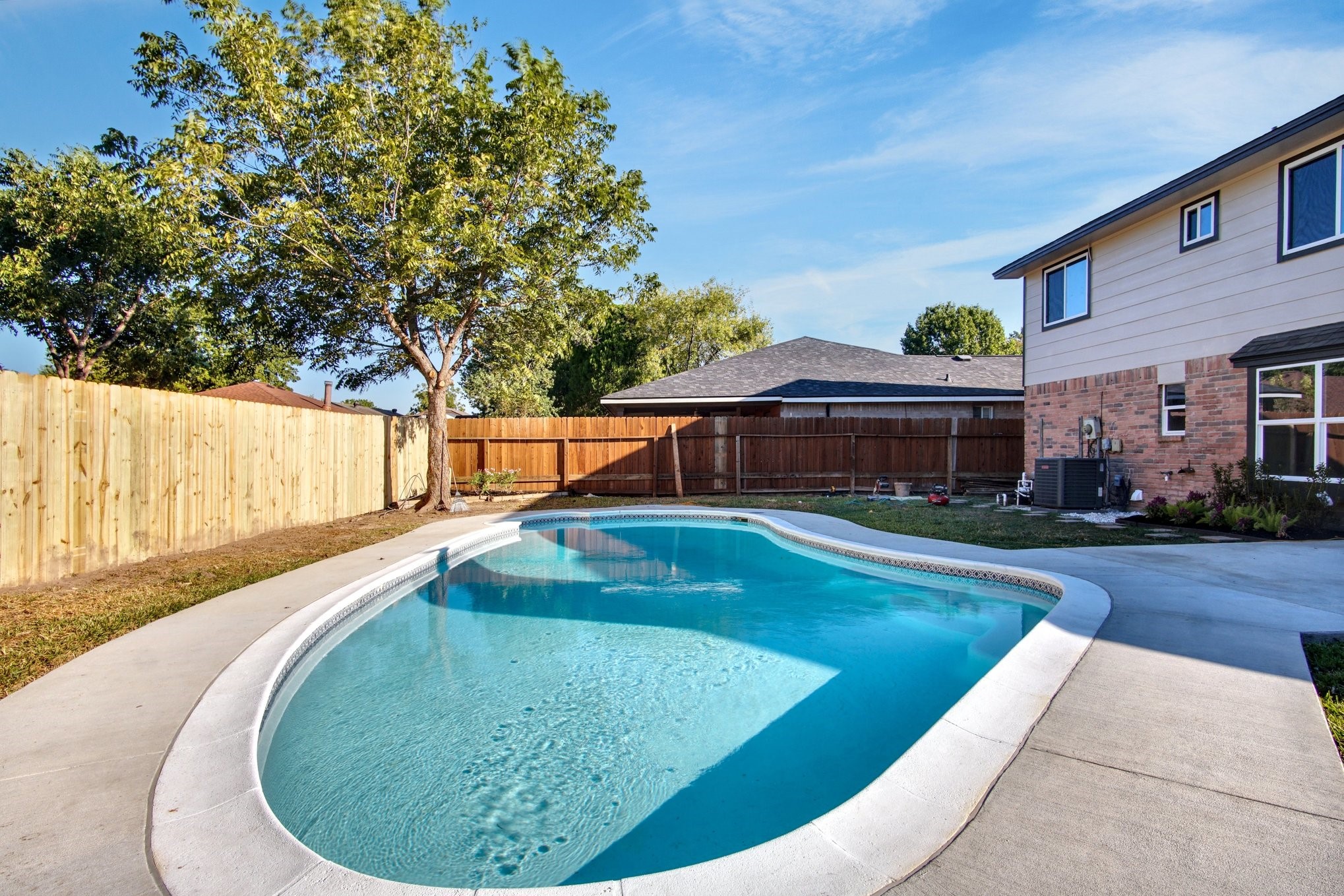7511 Weatherhill Lane Houston, TX 77041 - Photo 5 of 40 Enormous Pool! Fully refurbished from the deck, to the surface, plumbing and light.