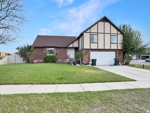 1716 Sagewood Road Price, UT 84501 - Photo 73 of 73 Brick and stucco exterior with decorative timber framing, a two-car garage, and a concrete driveway