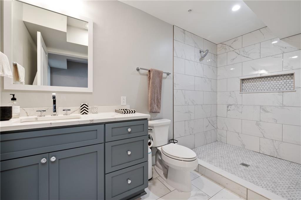 172 43rd Street Pittsburgh, PA 15201 - Photo 13 of 25 a bathroom with a sink a toilet and shower
