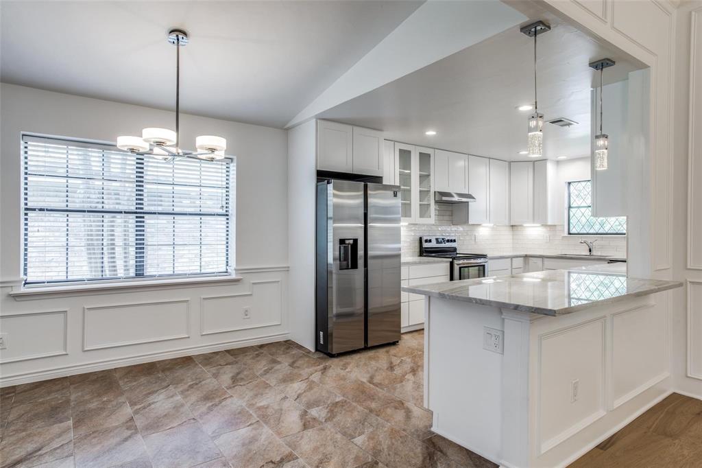 6926 Northwood Road Dallas, TX 75225 - Photo 11 of 29 a kitchen with refrigerator and window