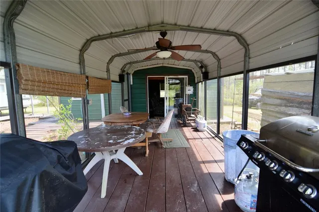 a view of a backyard with sitting area