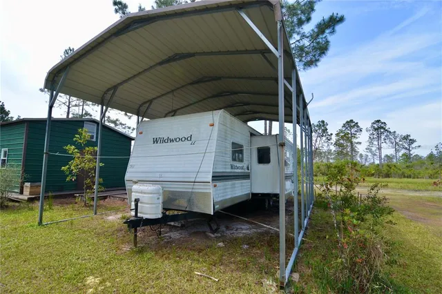 a hallway with furniture and a window