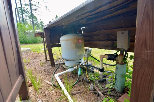 a view of a hallway with wooden walls